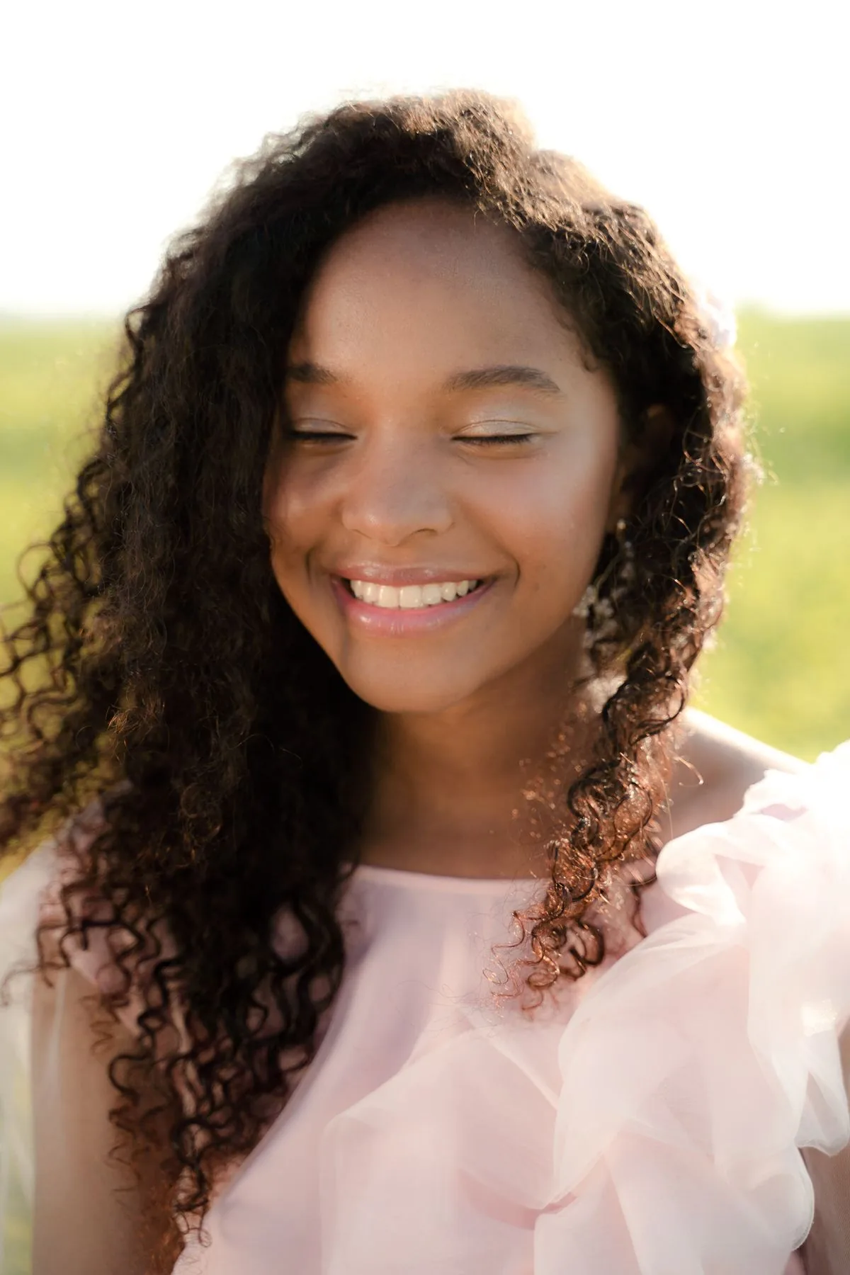A portrait photo of a smiling woman animated into a moving clip with Muse AI Video