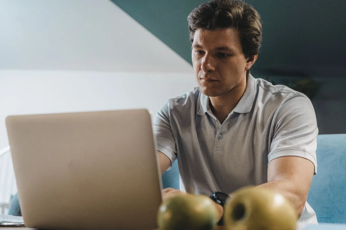 A solo founder working on a laptop, making budget ad creative with Muse AI Video Veo 3.1